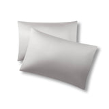 Two pillows one on top of the other with the Bamboo Sateen Pillowcases in Dove Gray on them