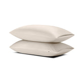 Two pillows stacked one on top of the other with the Bamboo Sateen Pillowcases in Sand Stone on them