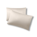 Two pillows one on top of the other with the Bamboo Sateen Pillowcases in Sand Stone on them
