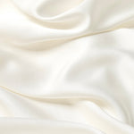 Close up of the bamboo sateen fabric: A soft off-white