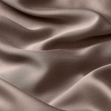 Close up of the bamboo sateen material: A medium grey-brown