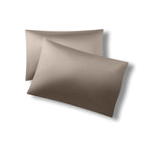 Two pillowcases on one another with the Bamboo Sateen Pillowcases in Truffle on them