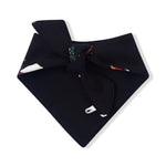 A folded black bandana with a small colorful patterned detail near the top center, displayed on a clean white background.