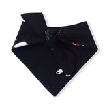 A folded black bandana with a small colorful patterned detail near the top center, displayed on a clean white background.
