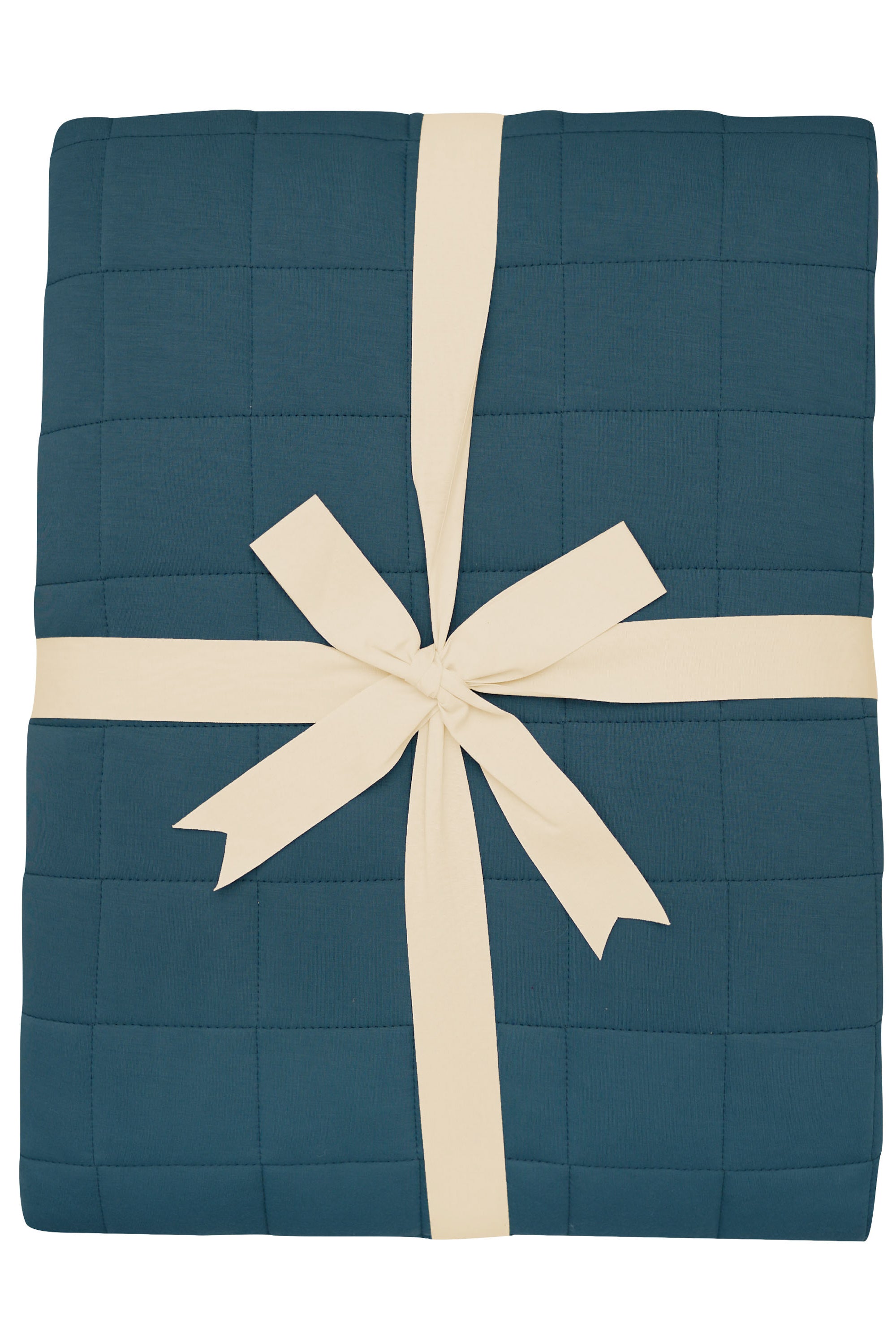 Quilted Blanket in Atlantic 2.5 TOG wrapped with an ivory bow