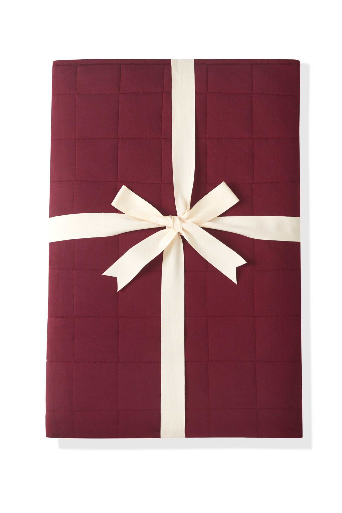 Adult Quilted Blanket in Burgundy 2.5 wrapped in a ribbon bow on a white background
