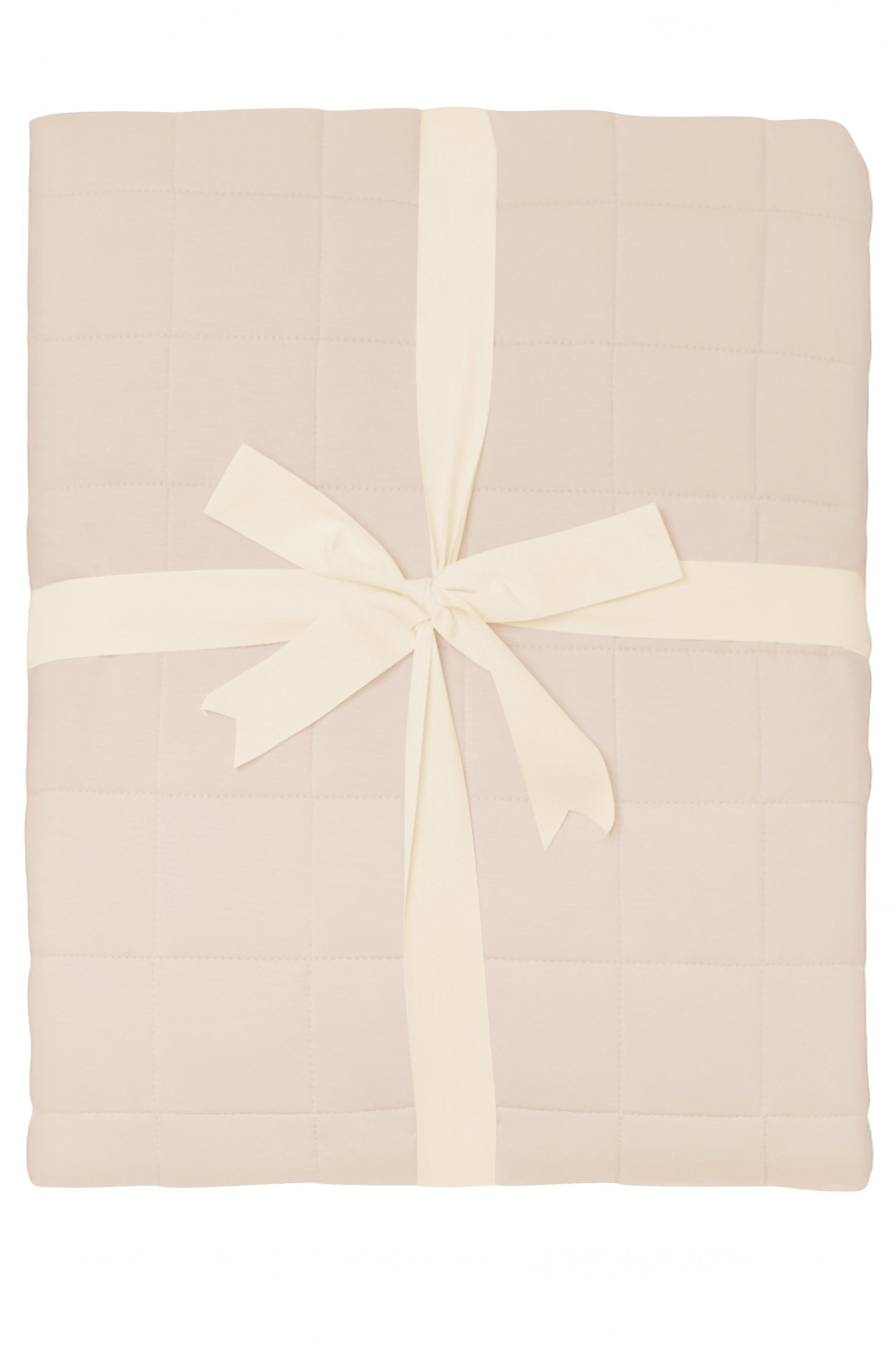 Product photo of the Bamboo Quilt Blanket in Bisque 2.5 wrapped in an ivory bow