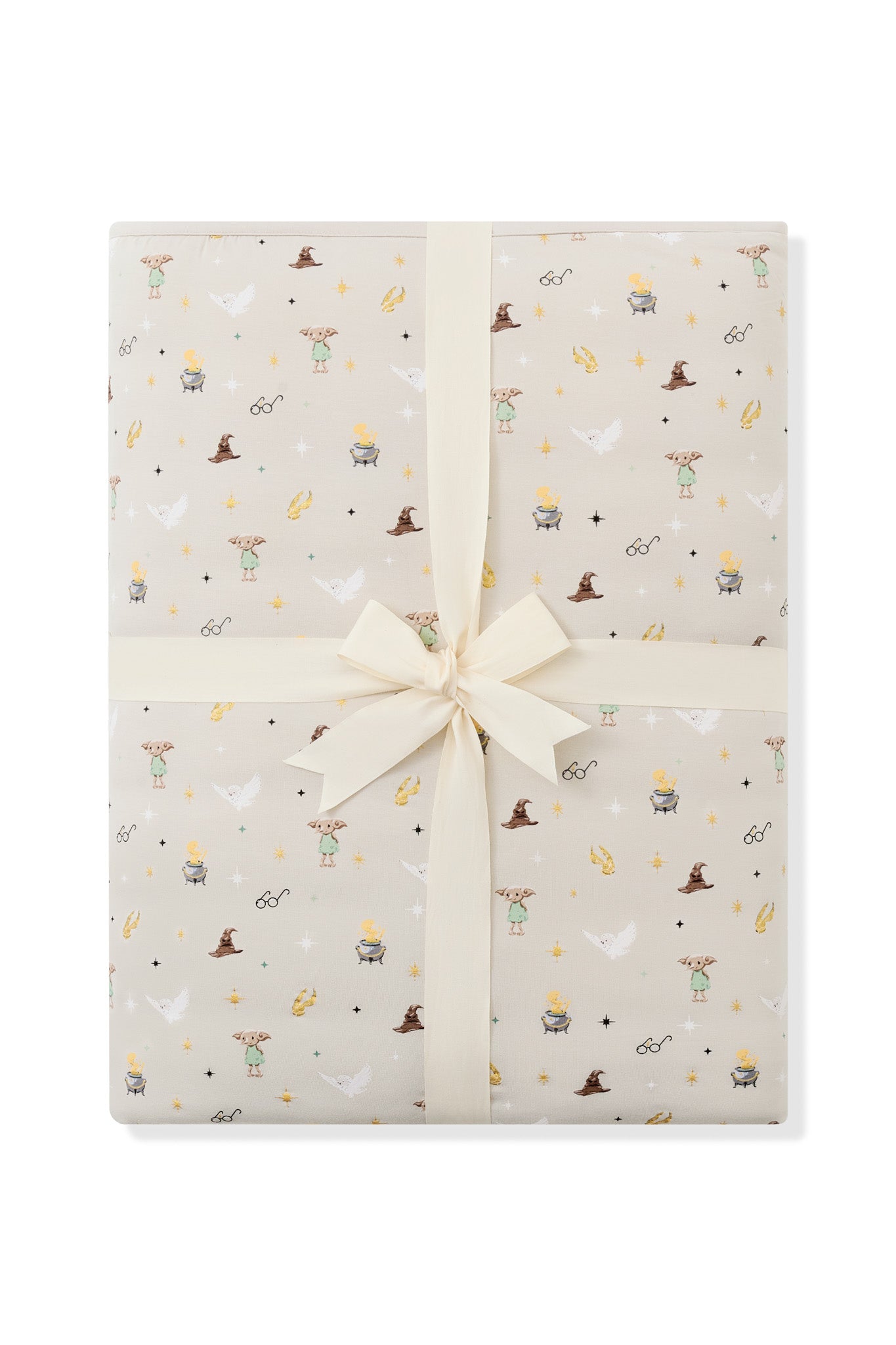 Folded Quilt Blanket in Starry Icon 2.5 on a white background with an ivory bow 