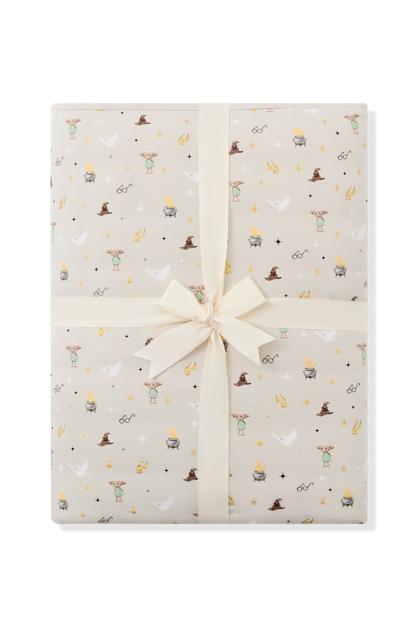 Folded Quilt Blanket in Starry Icon 2.5 on a white background with an ivory bow 