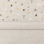 Folded Quilt Blanket in Starry Icon 2.5 displaying printed and quilted sides 