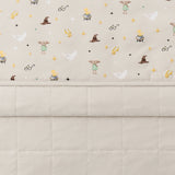 Folded Quilt Blanket in Starry Icon 2.5 displaying printed and quilted sides 