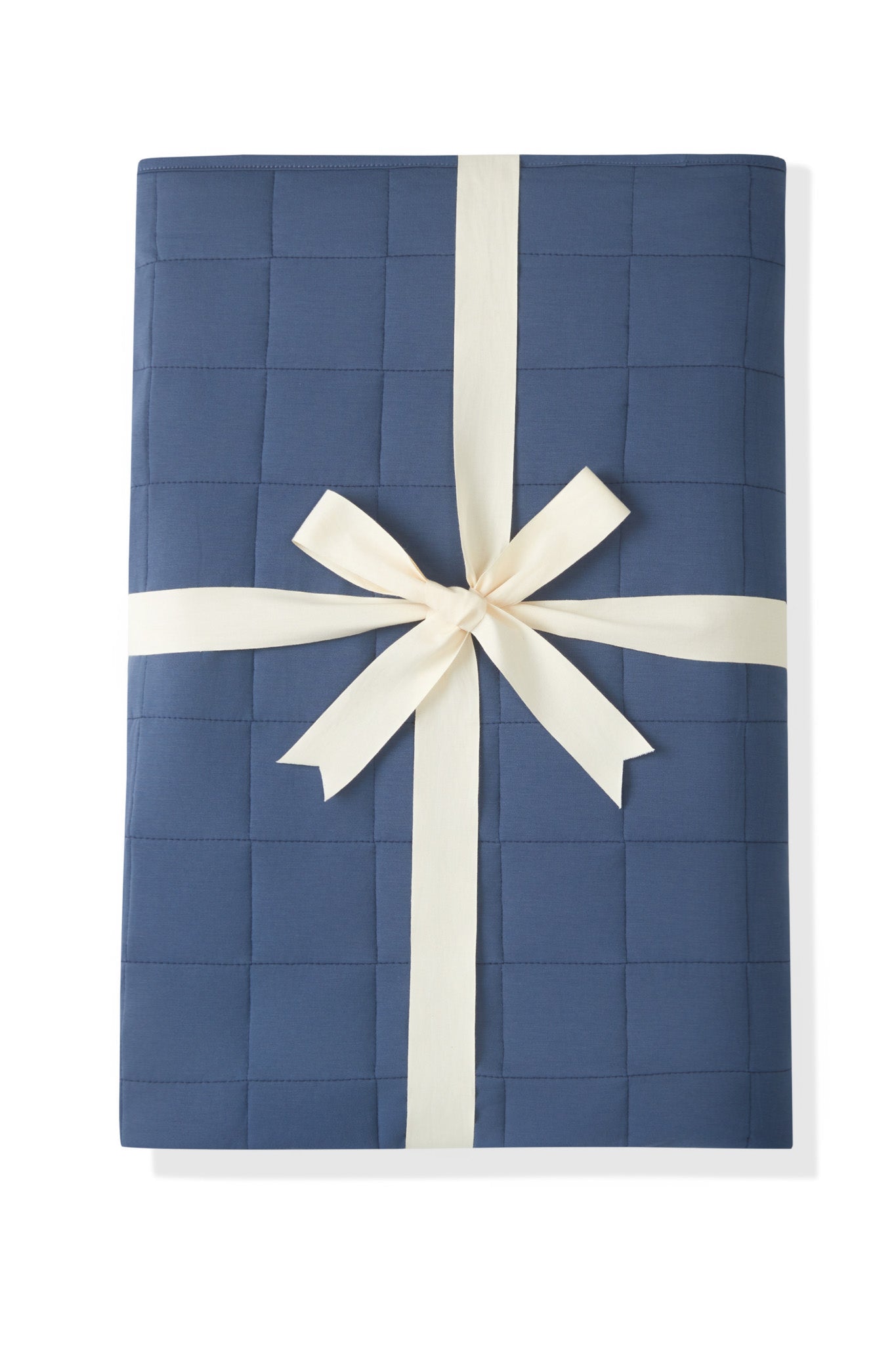 Adult Quilted Blanket in Oxford 2.5 wrapped in a ribbon bow on a white background