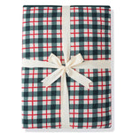 A folded gift box or package wrapped in a green, white, and red gingham plaid pattern, tied with a cream-colored satin ribbon and bow, on a white background.