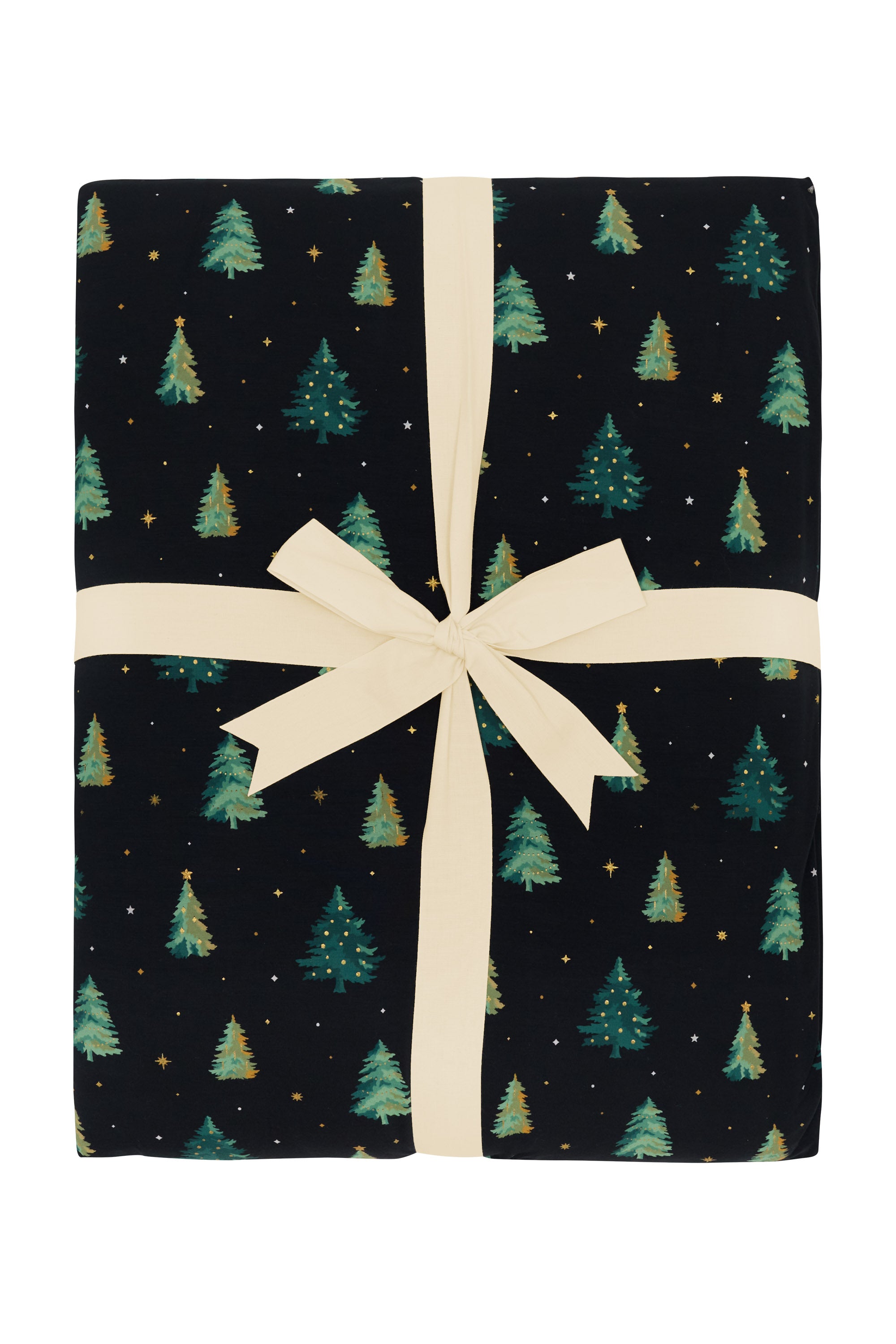 Product photo of the Kyte Bamboo Quilt Blanket in Twinkle Tree 2.5 wrapped in an ivory bow