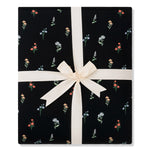 Folded Quilt Blanket in Midnight Wildflower 2.5 tied in an ivory bow