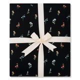 Folded Quilt Blanket in Midnight Wildflower 2.5 tied in an ivory bow