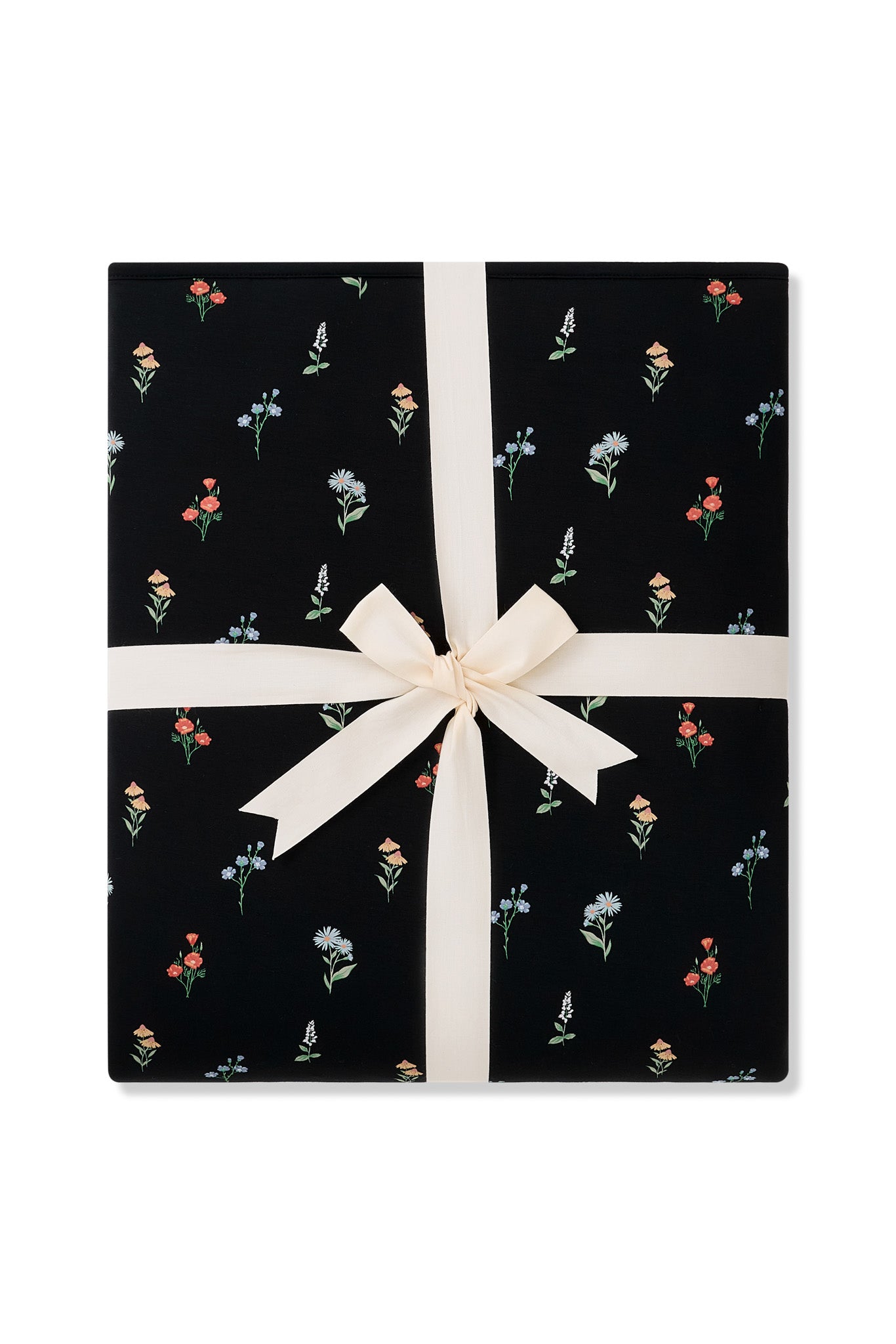 Folded Quilt Blanket in Midnight Wildflower 2.5 tied in an ivory bow