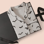 Long-Sleeved Women's Pajama Set in Bats packed in a box on a beige background
