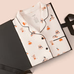 Long-Sleeved Women's Pajama Set in Halloween Teddy packed in a box on a beige background