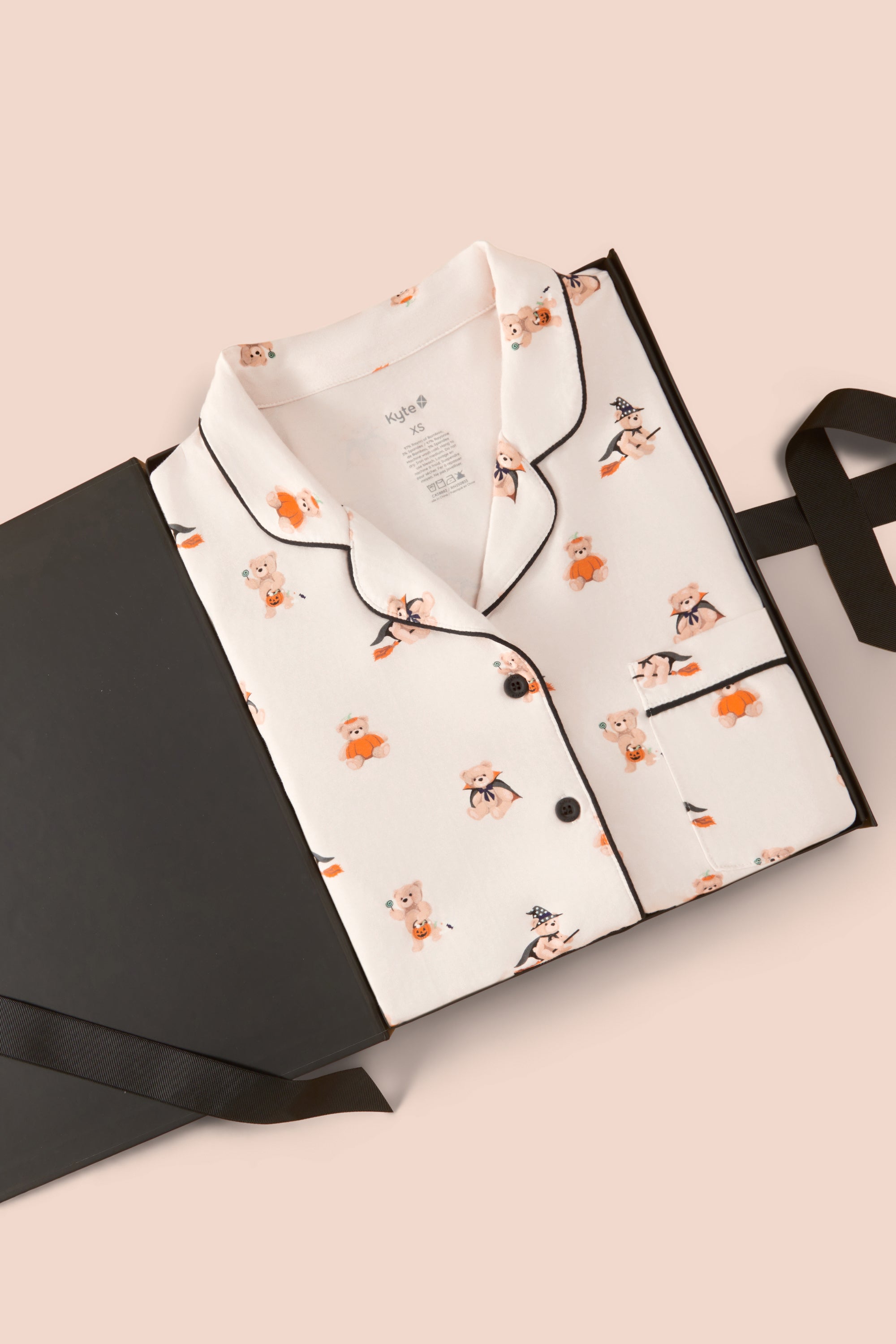 Long-Sleeved Women's Pajama Set in Halloween Teddy packed in a box on a beige background