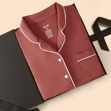 Long-Sleeved Women's Pajama Set in Ember packed on a beige background