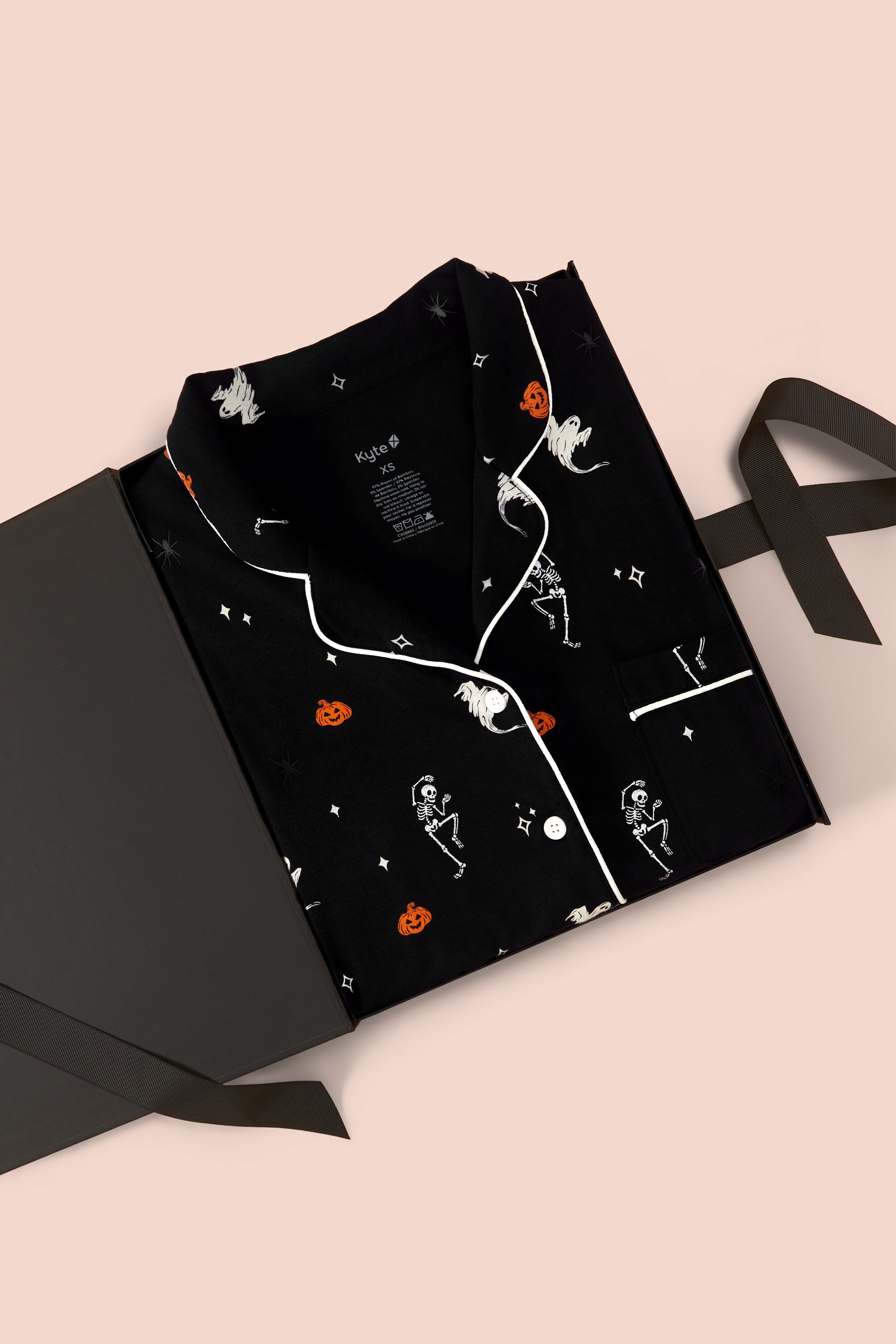 Long-Sleeved Women's Pajama Set in Halloween Friends packed in a box on a beige background