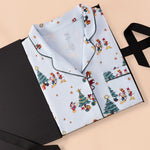 Long-Sleeved Women's Pajama Set in Mickey & Friends Christmas print packed in a black box on a beige background