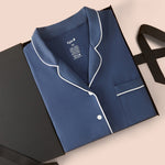 Long-Sleeved Women's Pajama Set in Oxford packed on a beige background