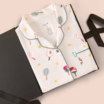 Long-Sleeved Women's Pajama Set in Pickleball print packed in a box on a beige background