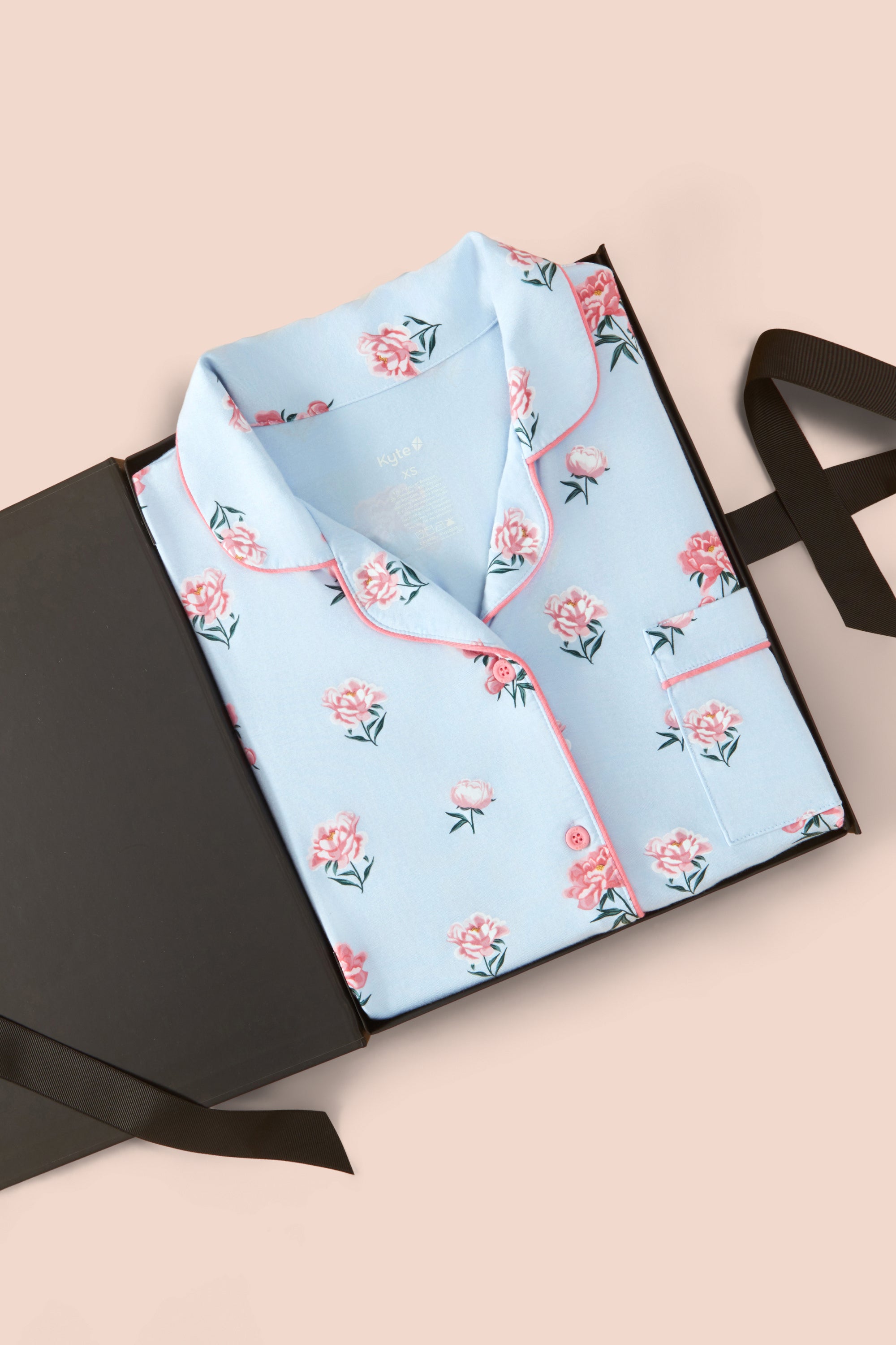 Long-Sleeved Women's Pajama Set in Breeze Peony packed in a box on a beige background