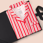 Long-Sleeved Women's Pajama Set in red and white Peppermint Stripes print packed in a box on a beige background