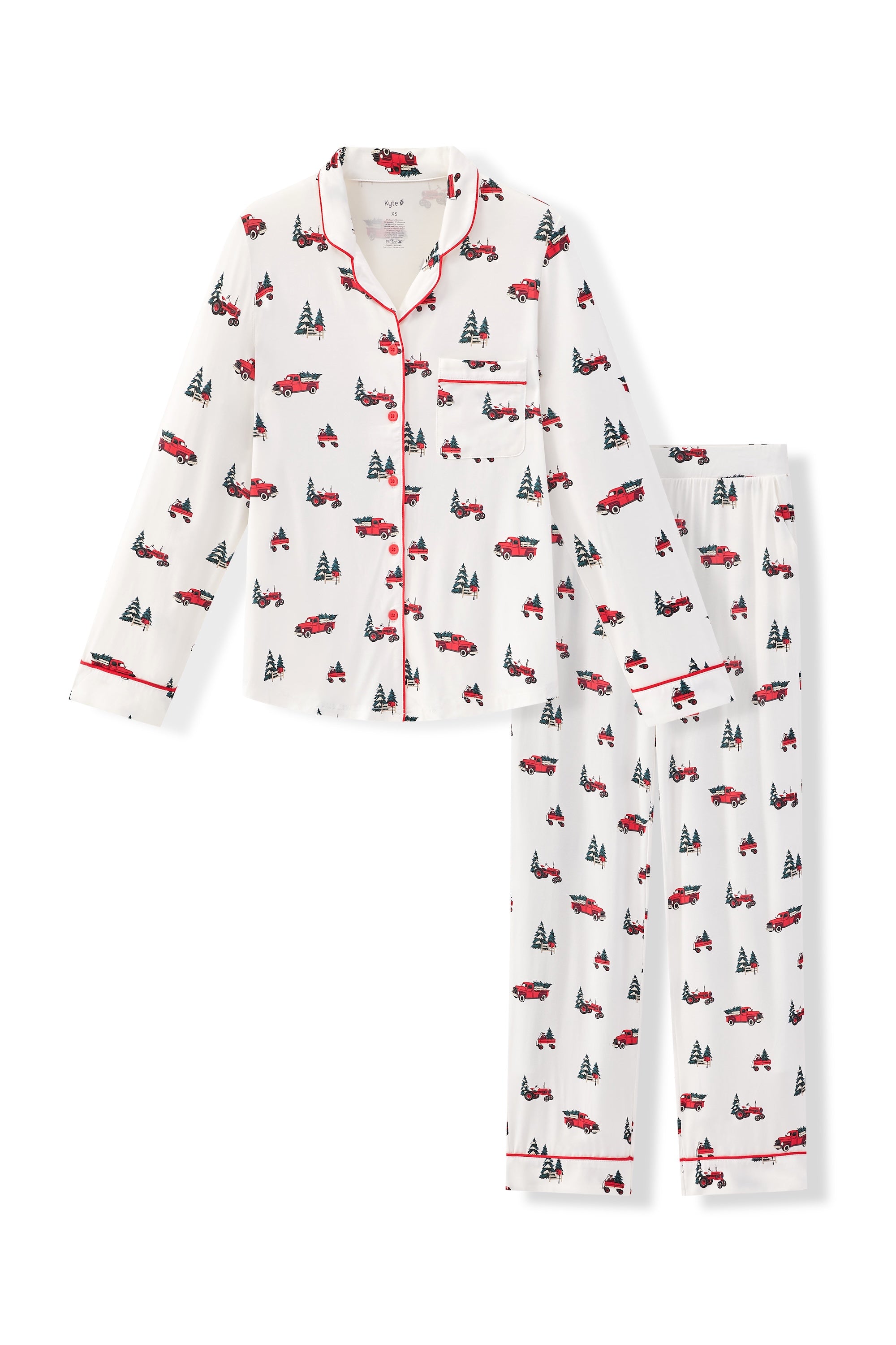 Flat lay of long sleeve pajama set in holiday tree farm