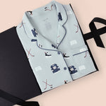 Long-Sleeved Women's Pajama Set in Vintage Hockey print packed in a box on a beige background