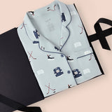 Long-Sleeved Women's Pajama Set in Vintage Hockey print packed in a box on a beige background