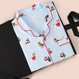 Men's Long Sleeve Pajama Set in Holiday Pups print packed in a box on  a beige background