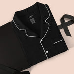 Men's Long Sleeve Pajama Set in Midnight packed in a box on a beige background