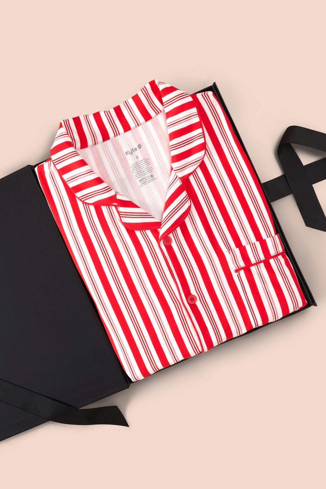 Men's Long Sleeve Pajama Set in red and white Peppermint Stripes print packed in a box on a beige background
