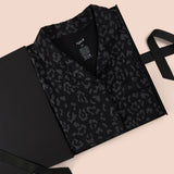 Women’s Short Sleeve Pajama Set in Midnight Leopard packed in a box on a beige background