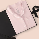 Women’s Short Sleeve Pajama Set in Blush with Cloud Trim packed in a box on a beige background