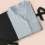 Women’s Short Sleeve Pajama Set in Fog with Cloud Trim packed in a box on  a beige background