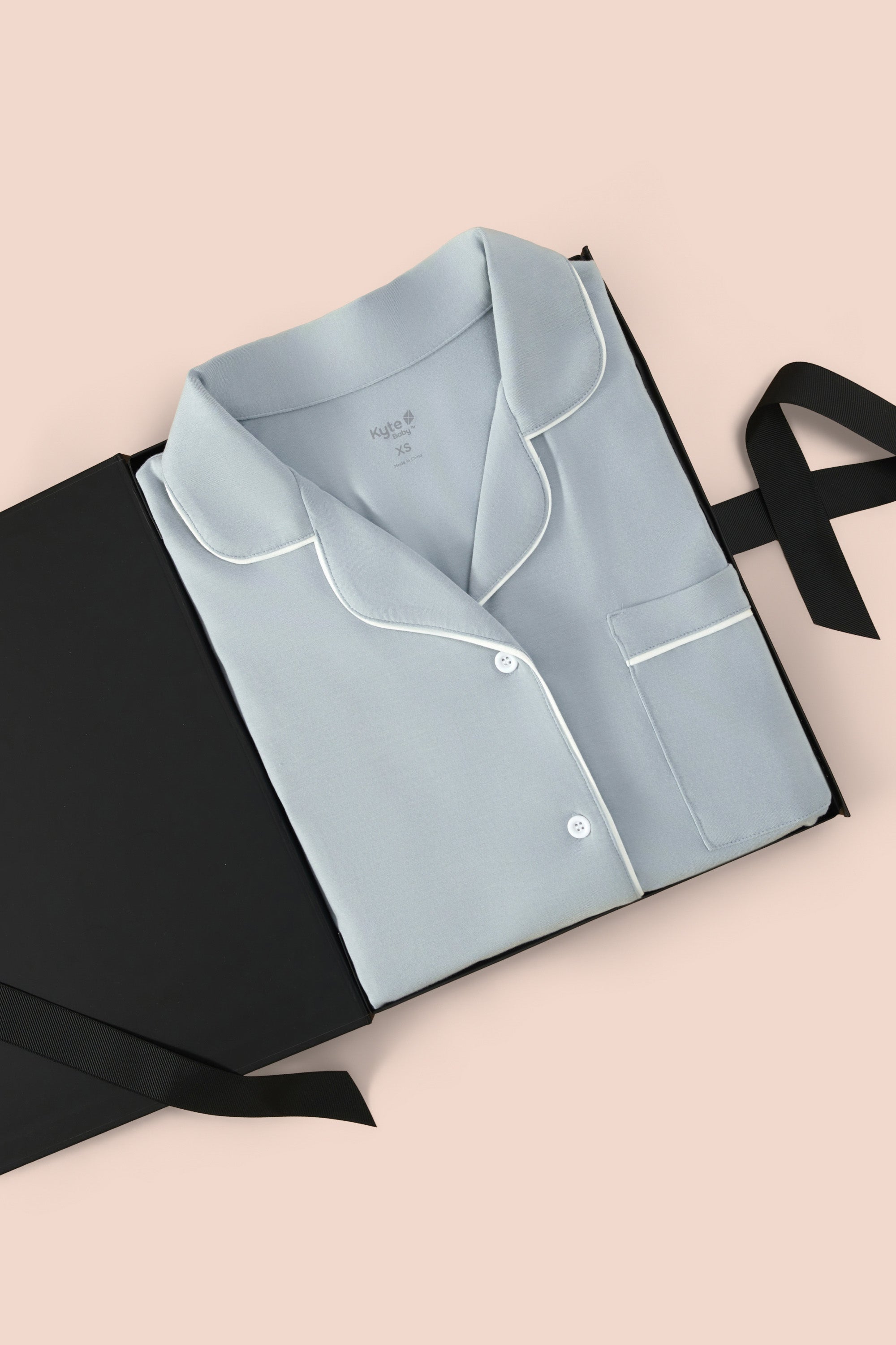 Women’s Short Sleeve Pajama Set in Fog with Cloud Trim packed in a box on  a beige background
