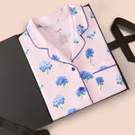 Women's Short Sleeve Pajama Set in Sakura Hydrangea packed in a box on a beige background