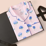 Women's Short Sleeve Pajama Set in Sakura Hydrangea packed in a box on a beige background