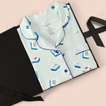 Long-Sleeved Women's Pajama Set in Dew Mahjong print packed in a box on a beige background