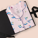 Long-Sleeved Women's Pajama Set in Sakura Mahjong print packed in a box on a beige background