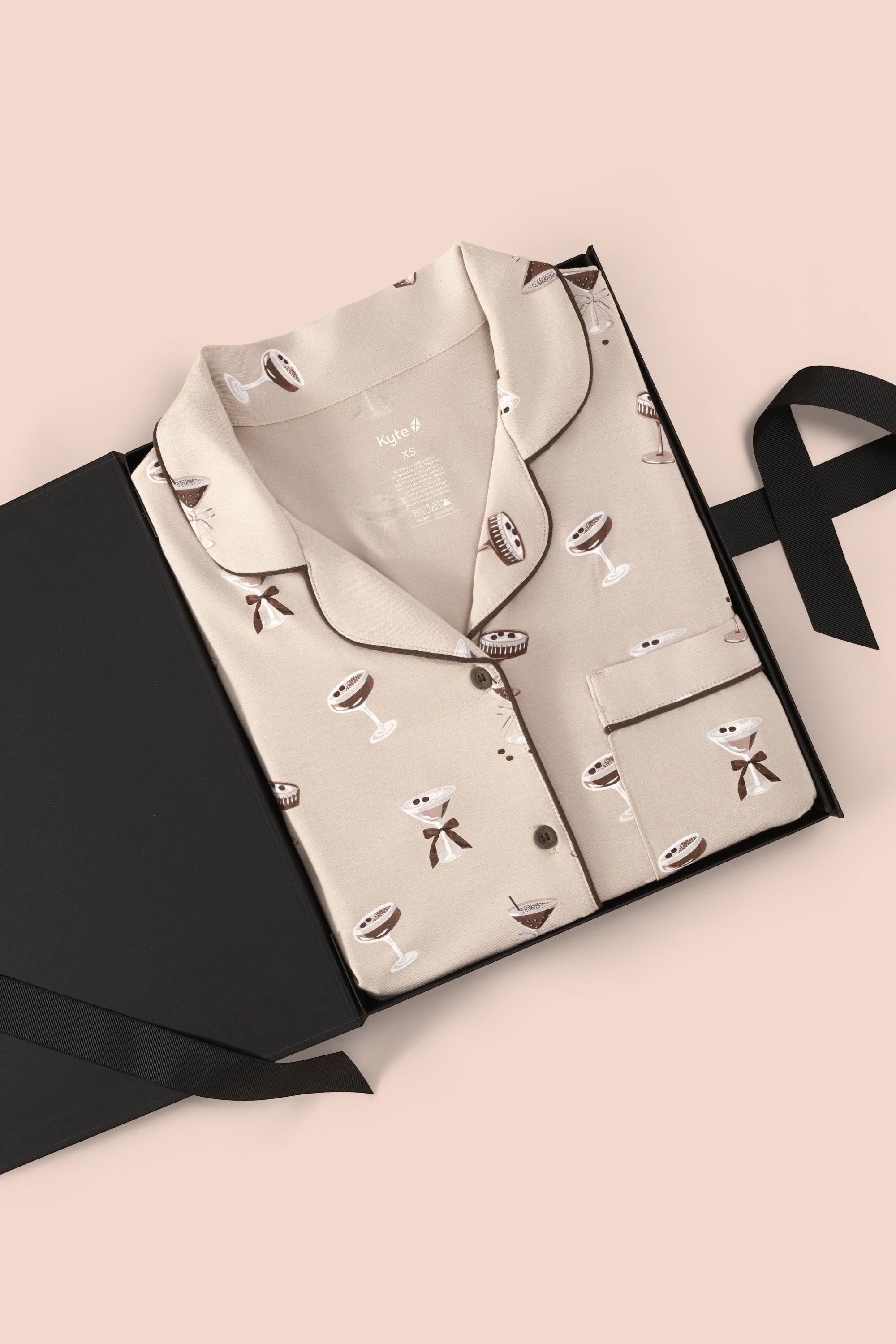 Long-Sleeved Women's Pajama Set in Espresso Martini print packed in a box on a beige background