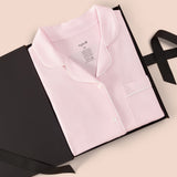 Women’s Short Sleeve Pajama Set in Sakura with Cloud Trim packed in a box on a beige background