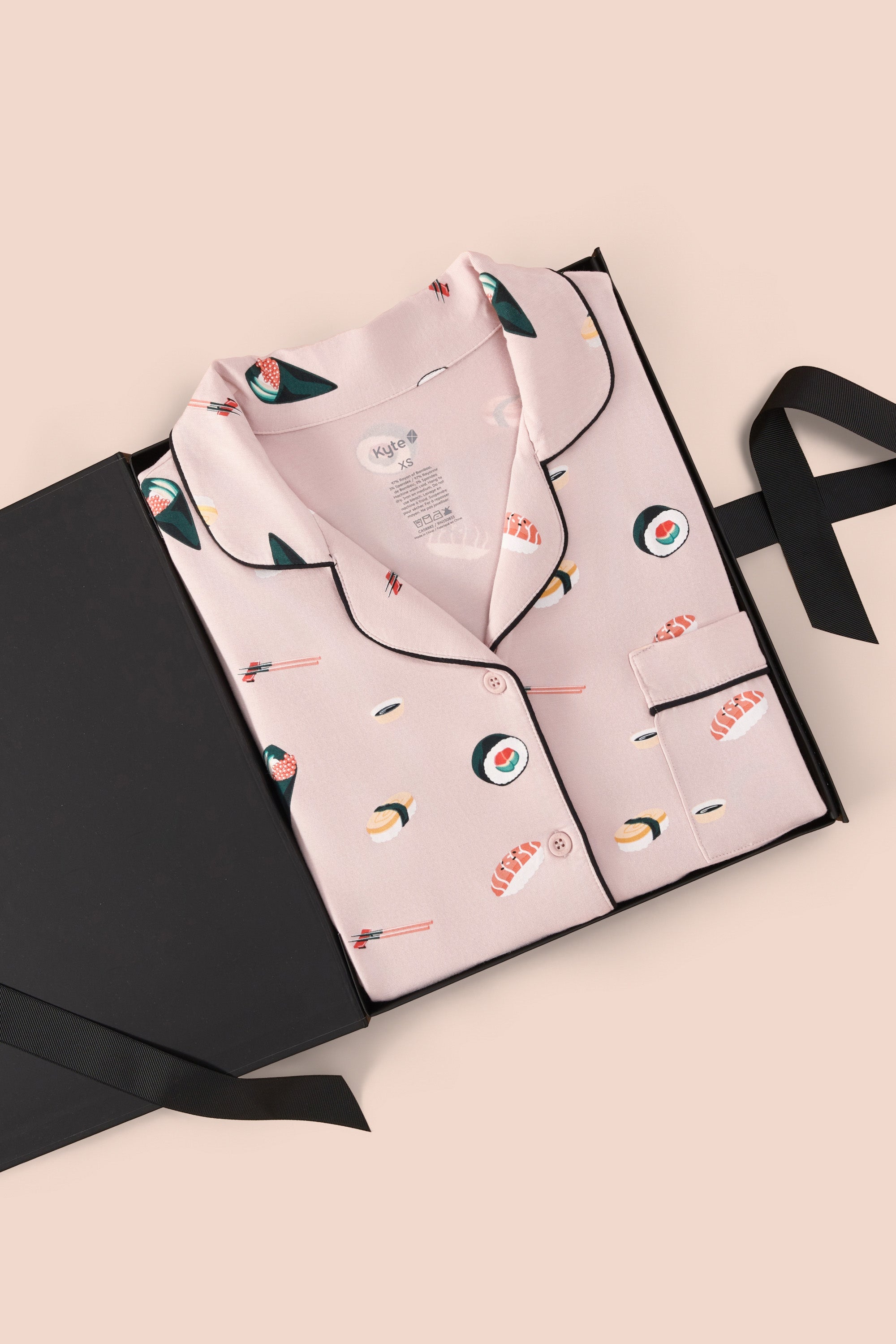 Women's Short Sleeve Pajama Set in Blush Sushi packed in a box on a beige background