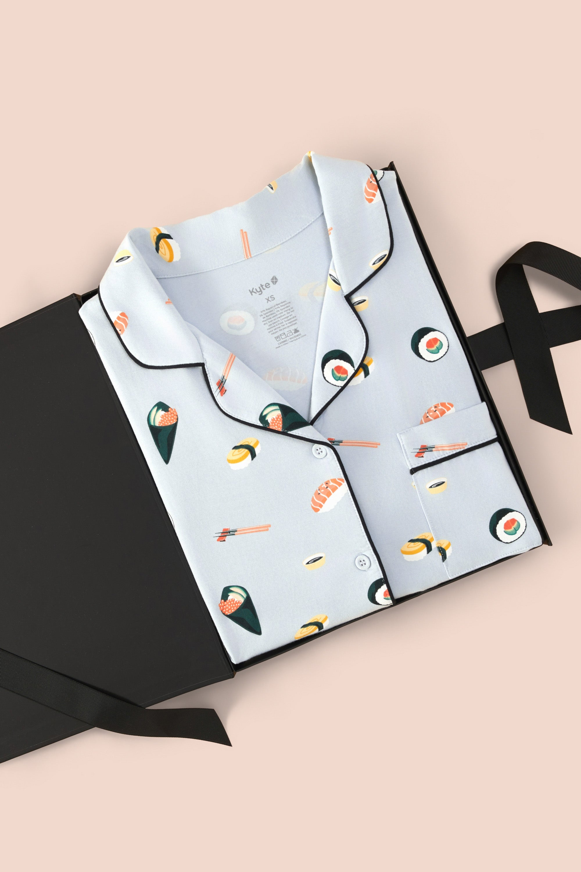 Women's Short Sleeve Pajama Set in Ice Sushi packed in a box on a beige background