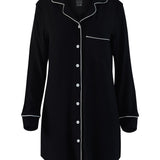 Black nightshirt with white piping on a white background